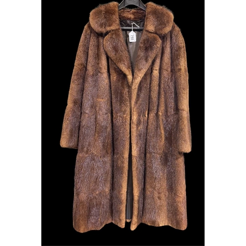 755 - A musquash fur coat, featuring a notched lapel collar, hook and eye fastenings, two outer pockets an... 