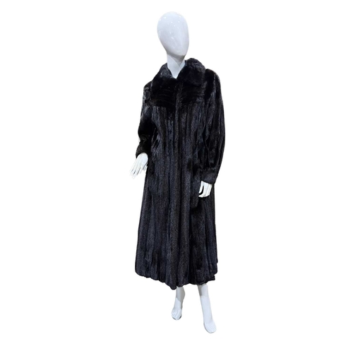 757 - A full-length dark ranch mink coat, featuring a lapel collar, hook and eye clip fastenings, two oute... 