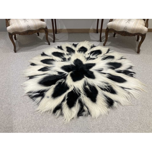 773 - A Black and White Colobus Monkey (Colobus angolensis) full circular fur rug, circa 1960s, circular f... 