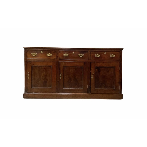 778 - A George III fruitwood standing dresser triple frieze drawers with stringing inlay and brass handles... 