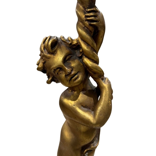 793 - A gilded gueridon stand modelled as a standing putto holding a cornucopia form aloft standing on a c... 