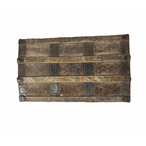 794 - A leather mounted dome top travel trunk, metal and wood banded, document folder affixed to the insid... 