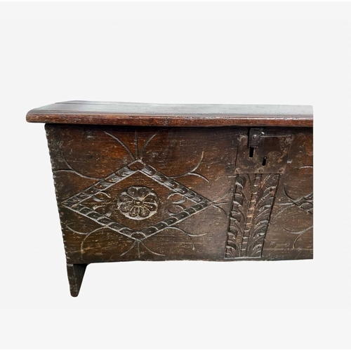 803 - A provincial Jacobean-style oak chest, possibly 17th or 18th century, plane moulded top opening to v... 