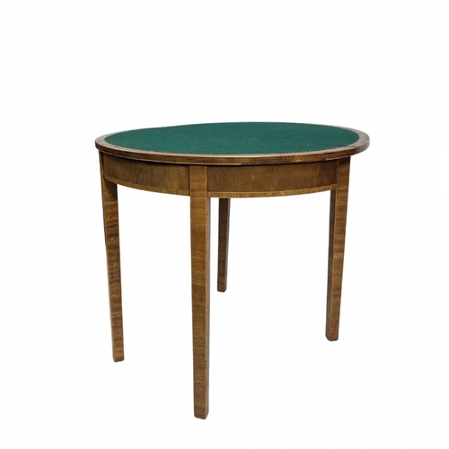 818 - A small Sheraton style sunburst mahogany veneered demilune fold over card table, green baise to the ... 