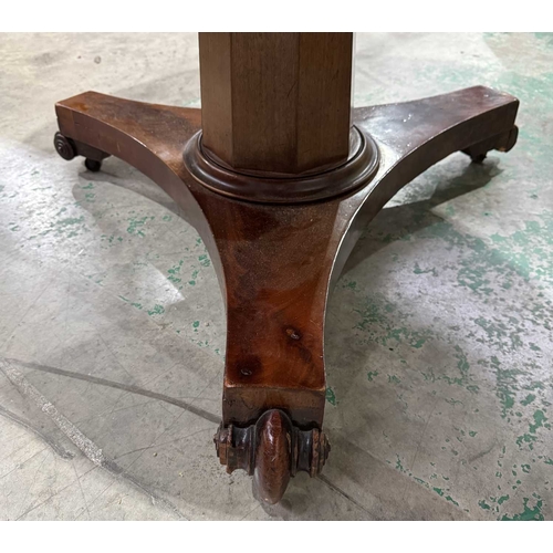 819 - A mahogany veneered breakfast table, circular top on a triangular form base with castors, 72cm high,... 