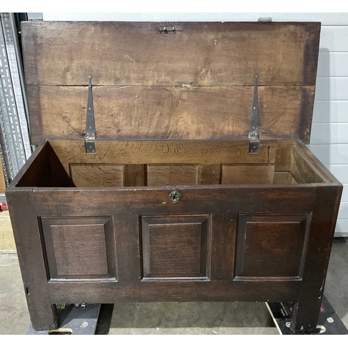 835 - An oak-panelled coffer or blanket chest, plane moulded top opening to void, metal decorative escutch... 