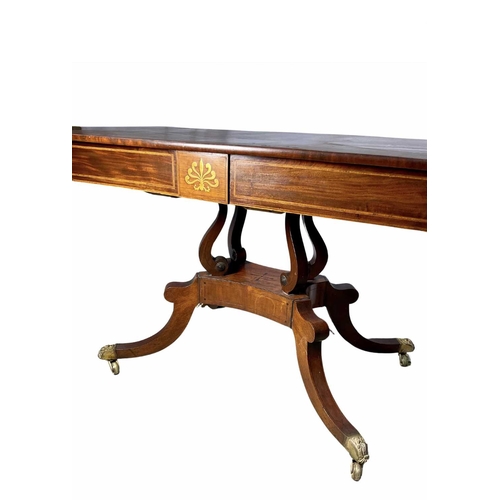 839 - A regency mahogany sofa table, drop down leaves, two pull out drawers, two dummy both with brass ant... 