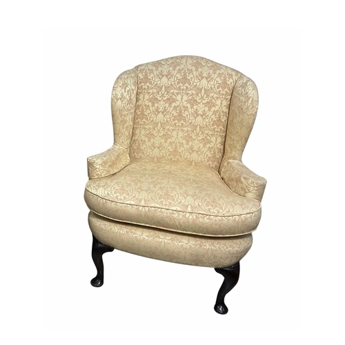 841 - A good quality wingback armchair in the Queen Ann style, 19th century or earlier, on cabriole legs d... 