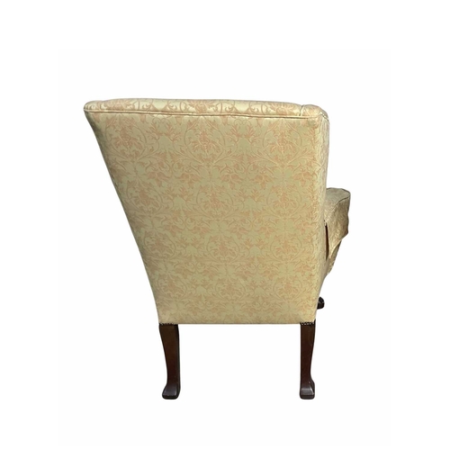 842 - A late 19th/early wingback armchair in the George II style, cabriole legs carved with a shell knee t... 