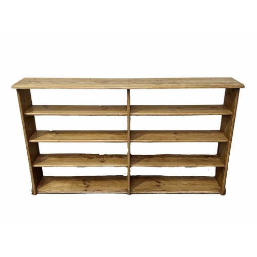 854 - A set of stripped pine open bookshelves with eight sections, 103 high, 173 wide by 27cm deep (1)... 