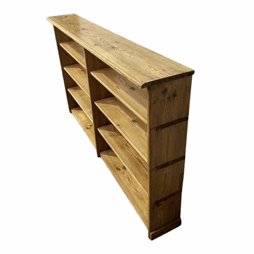 854 - A set of stripped pine open bookshelves with eight sections, 103 high, 173 wide by 27cm deep (1)... 