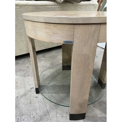 863 - A Brigitte Forestier 'Grandeur de Nature' round table in light oak with a central glass shelf, 61cm ... 