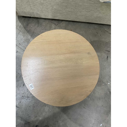 863 - A Brigitte Forestier 'Grandeur de Nature' round table in light oak with a central glass shelf, 61cm ... 