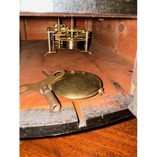 867 - A 19th century 'Rudges Stores' wall-mounted clock, circular mahogany cushion frame with brass casing... 