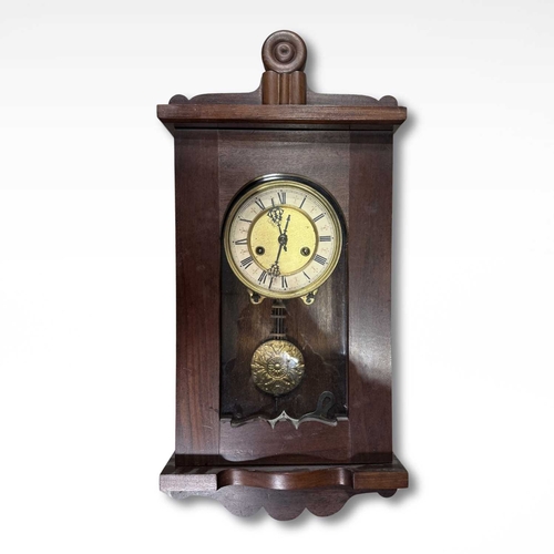 868 - Clocks: an Arts and Crafts style wall clock in mahogany (dual fusee) (pendulum/key) (1)