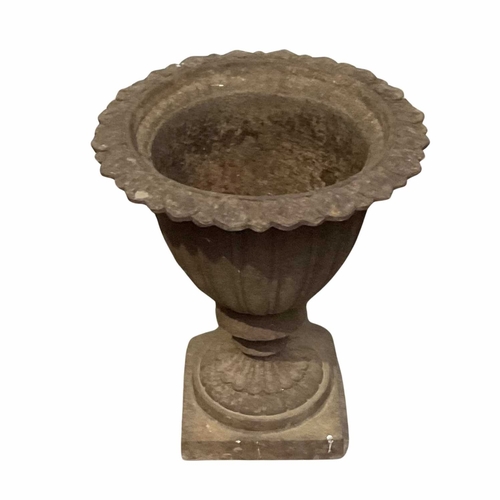 872 - A Coalbrookdale-type iron campana urn or planter, with a cast fluted body mounted on a square pedest... 