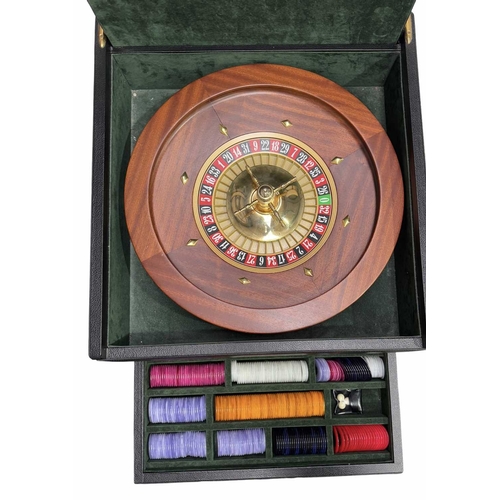 91A -  
A cased roulette wheel and complete accessories by Reno Romagnoli, green velvet lined with interna... 