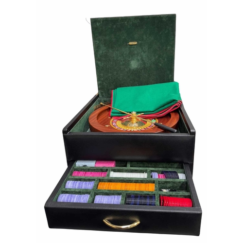 91A -  
A cased roulette wheel and complete accessories by Reno Romagnoli, green velvet lined with interna... 