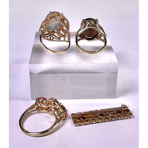 601 - Three gem-set rings, together with a 9ct gold sapphire and diamond brooch, two rings stamped 10k, on... 