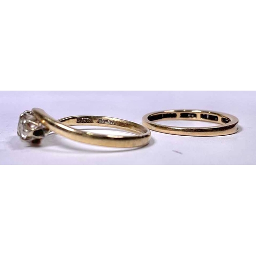 604 - Two diamond rings, to include a half eternity ring and a diamond three-stone ring, estimated total d... 