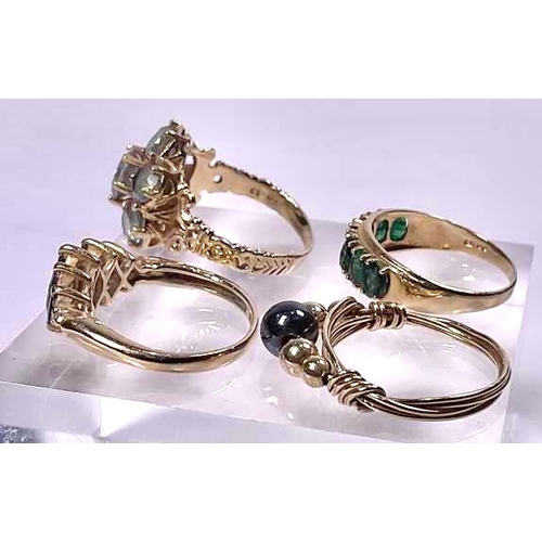 618 - Three gold coloured metal gem-set rings, together with a gold coloured metal hematite bead accent dr... 