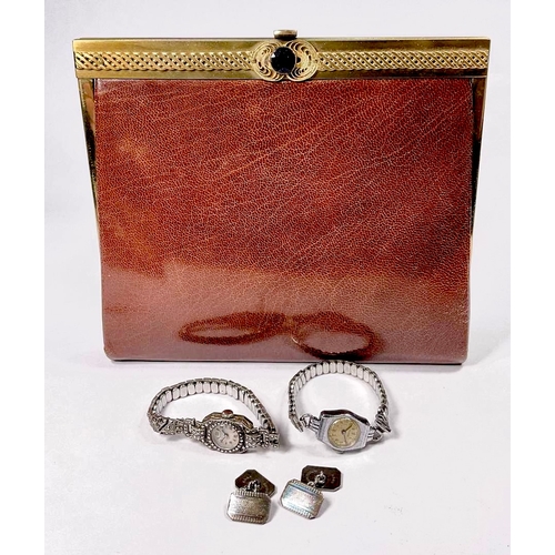 738 - A crushed brown morroco gilt metal mounted manicure set, in the form of a clutch bag, circa 1960s, w... 