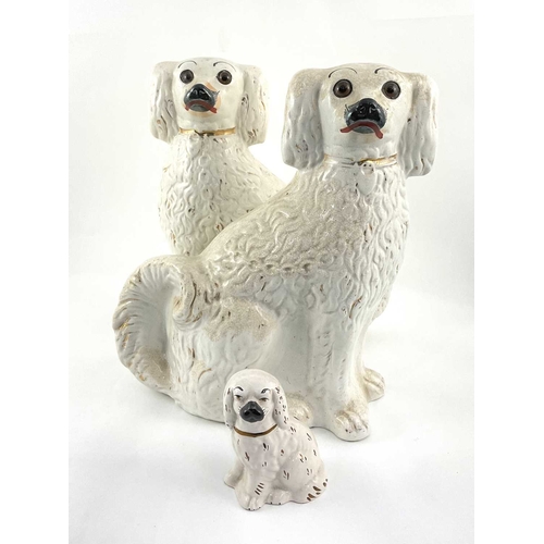 101 - Beswick: a pair of Staffordshire white spaniels 