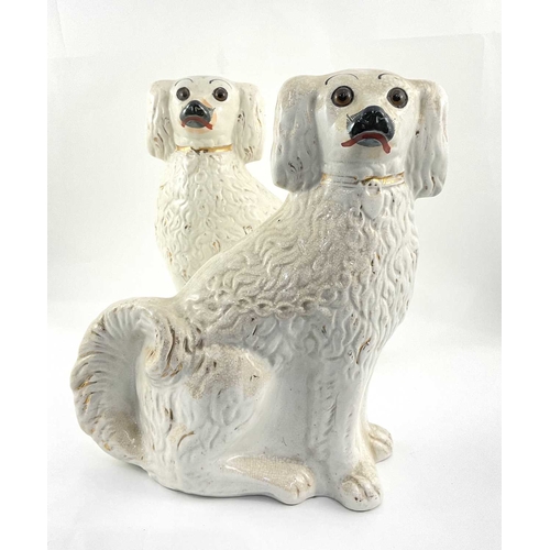 101 - Beswick: a pair of Staffordshire white spaniels 