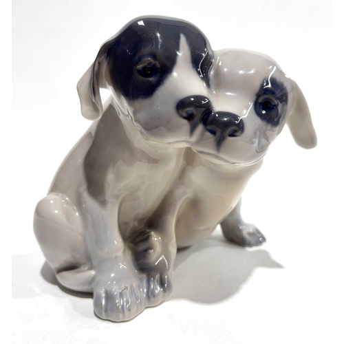 116 - Royal Copenhagen figure group of black and white glazed puppies, marks, painted and incised number '... 