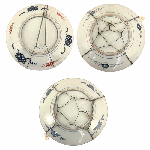 121 - Three Japanese Imari chargers, Meiji period, with hanging wires, the largest, 37cm diameter (3)