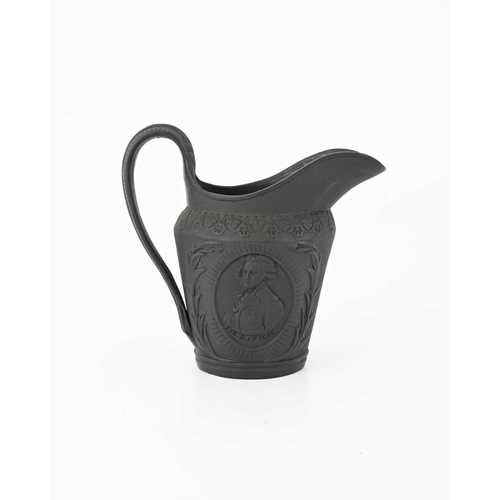 122 - A Wedgwood black basalt ware jug, circa 1790, shouldered helmet form, relief moulded portrait rounde... 