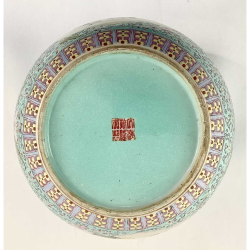 136 - A Chinese turquoise glaze bowl, painted with cartouche panels of figures in domestic settings, puce ... 