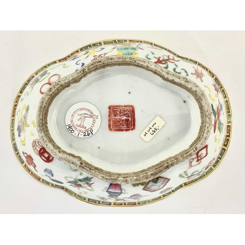 139 - A Chinese famille rose quatrefoil footed dish, painted with six scholars before a foliate decorated ... 