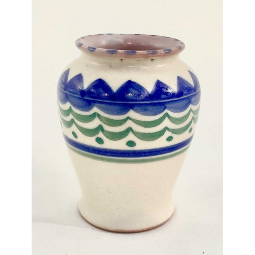 148 - A small Poole pottery vase, painted blue and green design on cream ground with Poole impressed marks... 