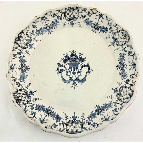 164 - A French faience plate, Rouen, 19th century, with scalloped rim, transfer printed with a basket of f... 