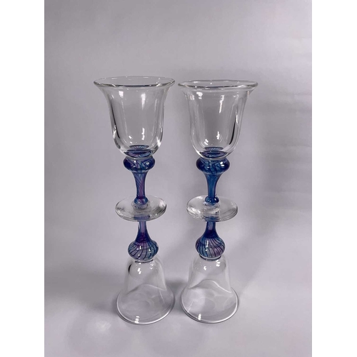 175 - Adrian Sankey studio glass including a set of four wine glasses, two iridescent vases of baluster fo... 