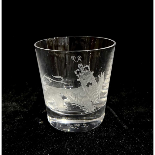 176 - Stephen Rickard for Stuart & Sons, Stourbridge, a glass tumbler decorated with a heraldic engraving ... 