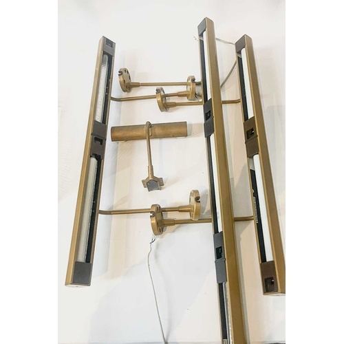 193 - Three bronzed metal picture lights by Linolite, two 68cm long, one 102cm long (3)