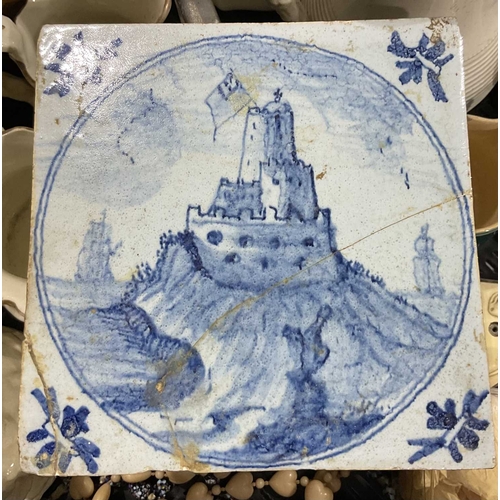 22 - A late 17th century blue and white delft tile with a roundel of a sandcastle, 19th century pewter li... 