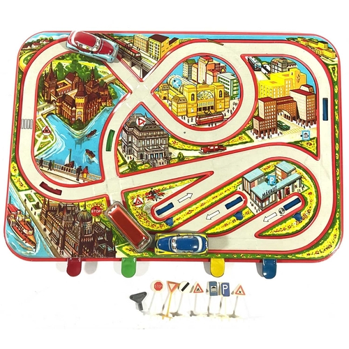 255 - A boxed sheet metal 'traffic control' or 'automobile/car track' game, c.1960, with three wind-up pai... 