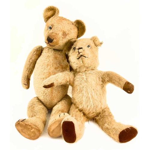 256 - Two straw-filled golden plush teddy bears with glass eyes, jointed limbs, and cloth pads, (loose gla... 