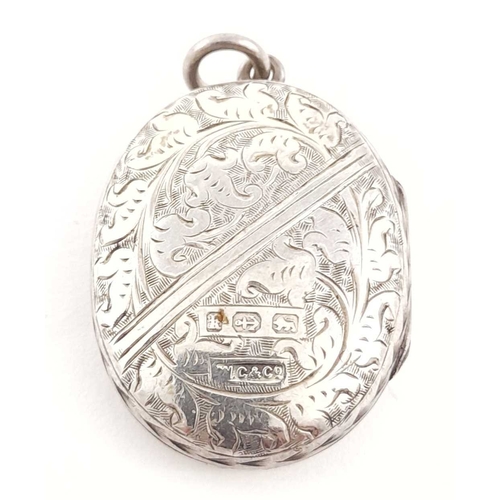 297 - A late Victorian silver engraved locket pendant, hallmark for Birmingham 1884, length 4cm, 11g