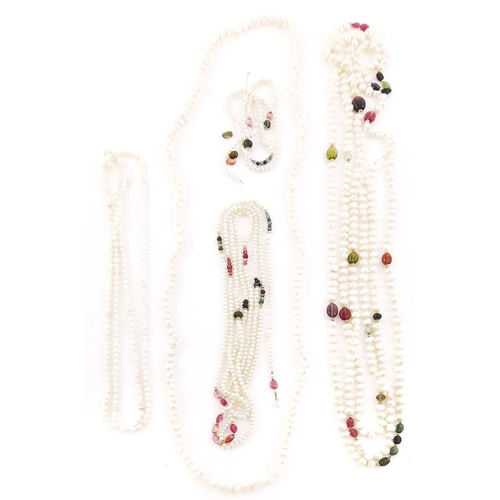 311 - Four pearl necklaces, two with multi-gem bead spacers including vari-coloured tourmalines, both stri... 