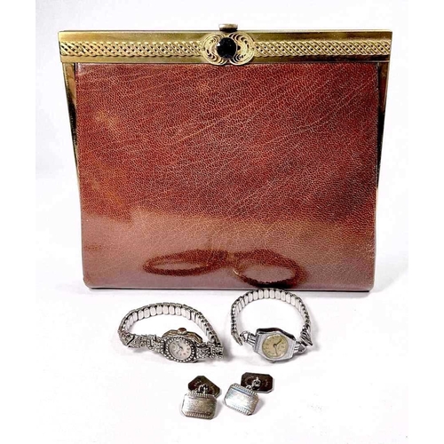 329 - A crushed brown morroco gilt metal mounted manicure set, in the form of a clutch bag, circa 1960s, w... 