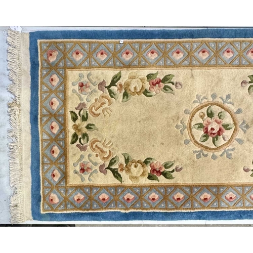 334 - Three small, medium and large 20th century Chinese export wool rugs of floral design, cream ground w... 