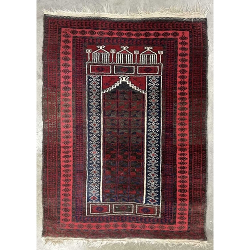 338 - An Afghan Baluch style wool prayer rug in red, navy and white palette, approx 120cm long, 80cm wide ... 