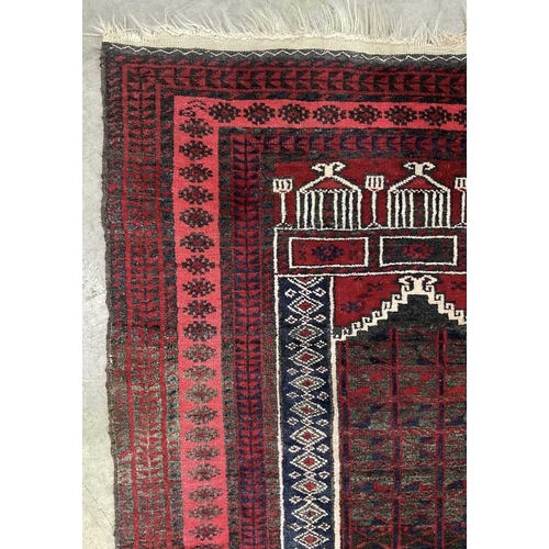 338 - An Afghan Baluch style wool prayer rug in red, navy and white palette, approx 120cm long, 80cm wide ... 