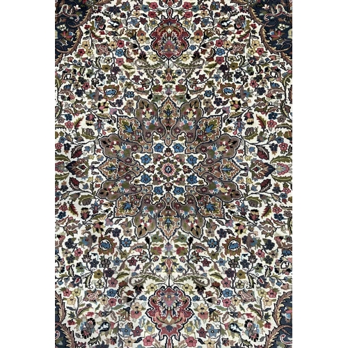 341A - A large Kashmar-type wool floral rug in a brown, cream, red and blue palette, approx 282cm long, 190... 