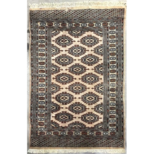 343 - Two rugs of tribal/Oriental design, one decorated with floral geometric forms on a cream ground, app... 