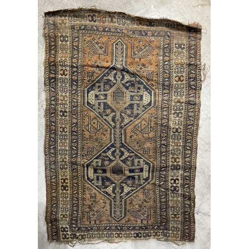 344 - A brown, orange and navy shiraz-type rug, ornamented with geometric motifs and zoomorphic animals ap... 